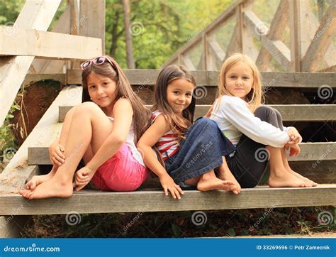 Barefoot Girl Sitting Outside