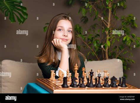 Portrait Serious Schoolgirl Chess Player Female Teen Posing Sitting At Chessboard Young Girl
