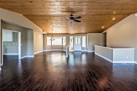 Rooms with both knotty pine walls and floors should be decorated simply so the wood may shine. Pine ceiling w/dark floor | Living room remodel, Rustic ...