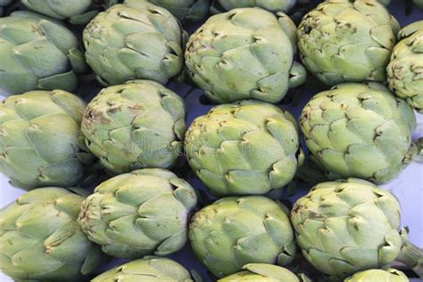 Background Of Fresh Artichokes For Sale At A Farmers Market Stock