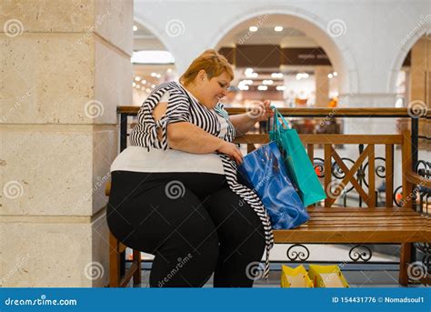 Fat Woman With Shopping Bags Sitting On The Bench Stock Photo Image Of Cloth Girl