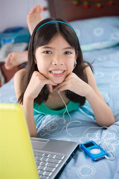 Girl Student Using Laptop While Listening To Music Stock Image Image