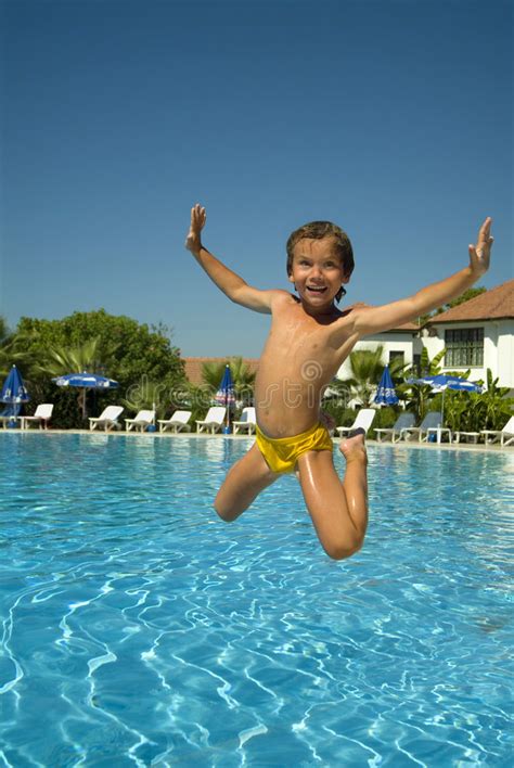 Boy Jumping Into The Pool Stock Photo Image Of Playful 7076692