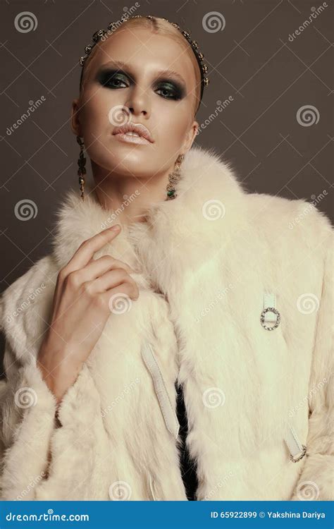 woman with blond hair and smokey eyes makeup wears luxurious fur coat stock image image of