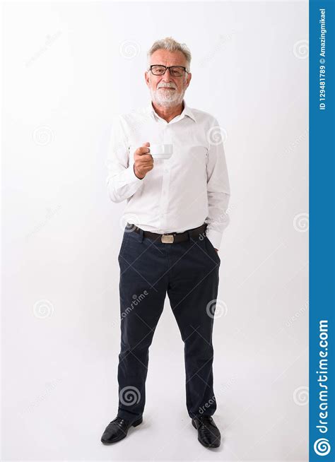 Full Body Shot Of Handsome Senior Bearded Man Standing And Holdi Stock