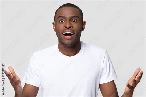 Amazed African American Man With Wow Face Feeling Excited By Unexpected