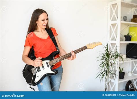 Young Woman Plays Electric Guitar At Home Stock Photo Image Of
