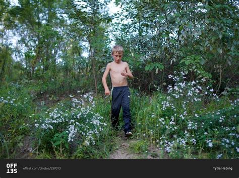 Shirtless Boy Walking On Forest Trail Stock Photo Offset