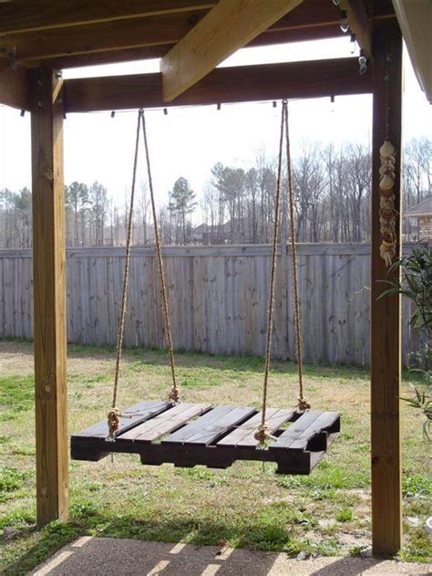 A beautiful hanging lounge that could fit perfectly in. 40 DIY Pallet Swing Ideas | 99 Pallets