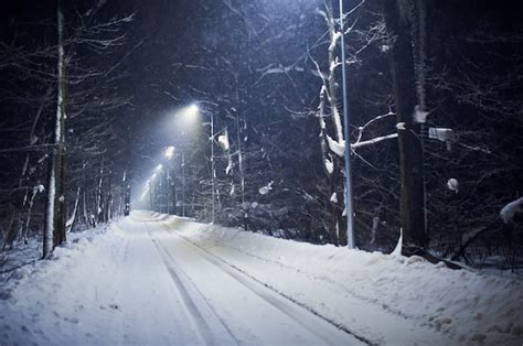 Premium Photo Landscape Of Empty Night Winter Road Covered By Snow