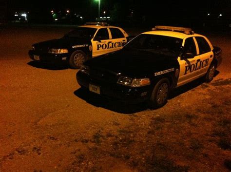 Two Of Our Crown Victoria Units Parked While The Officers That Drive