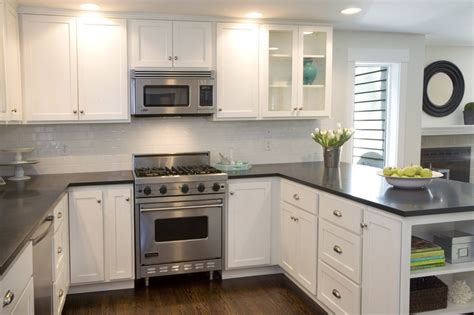 Beautiful kitchen with creamy white shaker cabinets paired with brown granite countertops and white porcelain diamond pattern tile backsplash. White cabinets dark countertops | KITCHEN | Pinterest ...