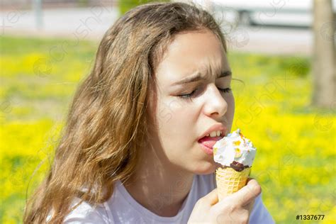 Beautiful Teen Girl Eating Ice Cream In A Waffle Cone Stock Photo Crushpixel