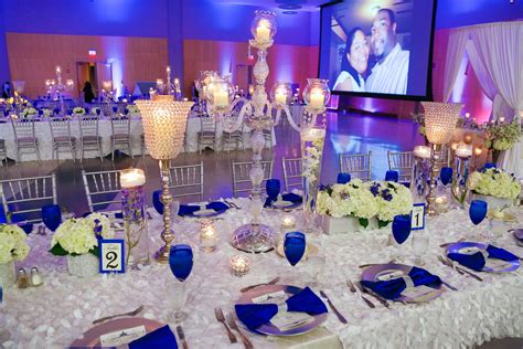 a wedding reception with blue and white decor