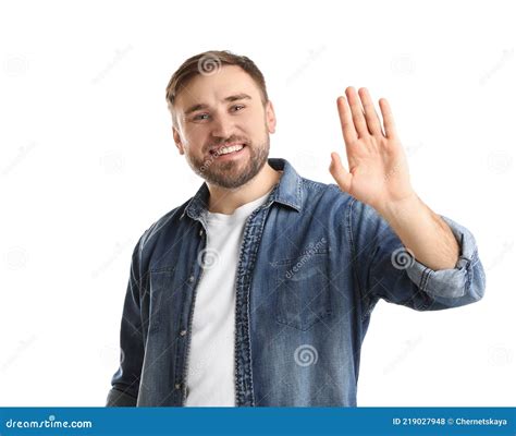 Happy Young Man Waving To Say Hello On White Background Stock Photo
