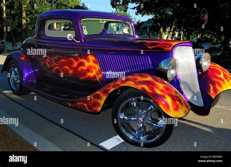 American Hot Rod With Flaming Paint Job Parked On Street In Small Town