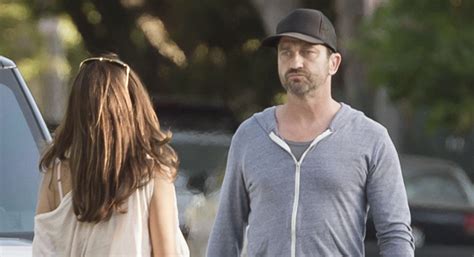 Gerard Butler And Girlfriend Morgan Brown Share A Kiss During Thursday