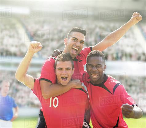 Soccer Players Celebrating On Field Stock Photo Dissolve