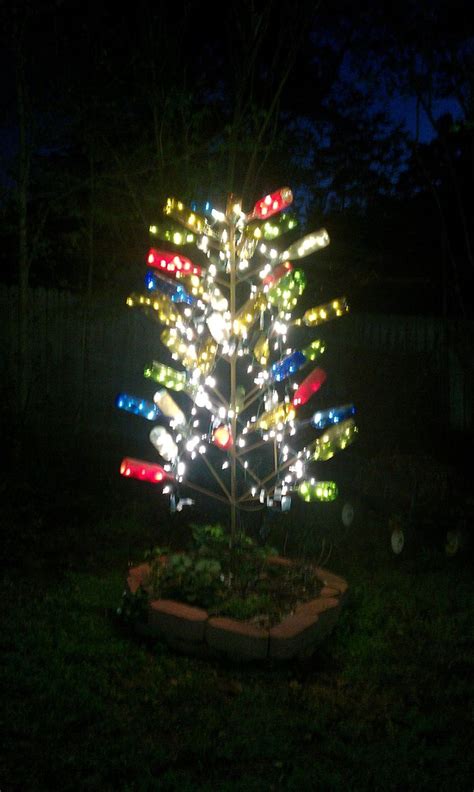 It contains led christmas lights. My bottle tree. Tree made of rebar, a variety of colored ...
