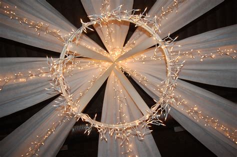 Diy dollar tree hula hoop wedding centerpiece. Canopy made from hula hoop, white landscaping fabric and ...