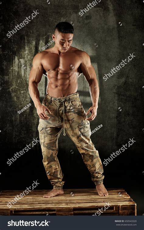 Male Bodybuilder Posing Studio Bare Upper Stock Photo