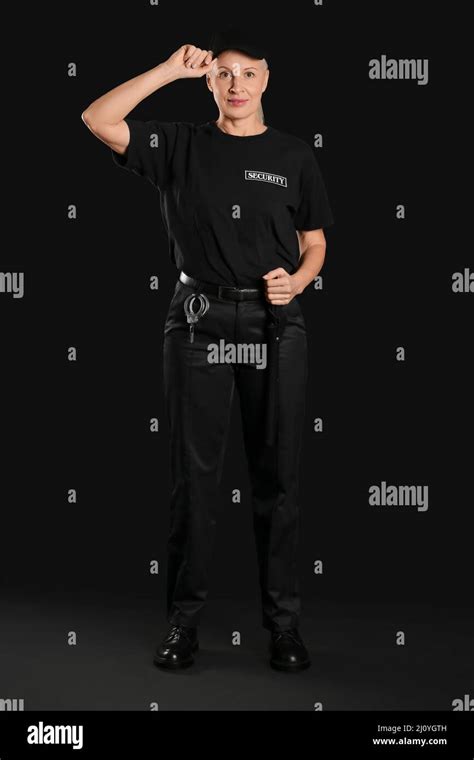 Female Security Guard On Dark Background Stock Photo Alamy