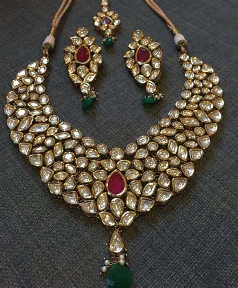 Kundan Gold Plated Set With Ruby Style Stones In Invisible Setting By