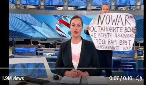 anti war activist interrupts live russian state tv news show the week