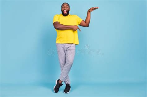 Photo Of Excited Pretty Dark Skin Guy Dressed Yellow T Shirt Smiling