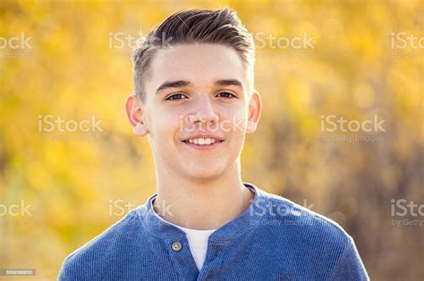 Portrait Of Smiling Teen Boy Outdoors Stock Photo Download Image Now