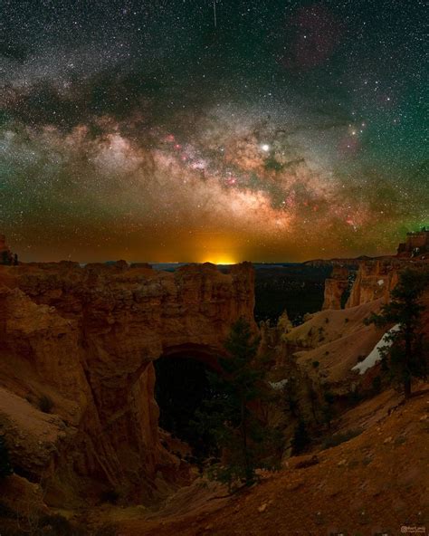 The Milky Way Galaxy Rising Above A Natural Bridge At Bryce Canyon Ut