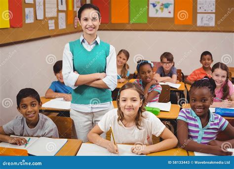 Teacher And Pupils Smiling At Camera In Classroom Stock Image Image Of Back Learn 58133443