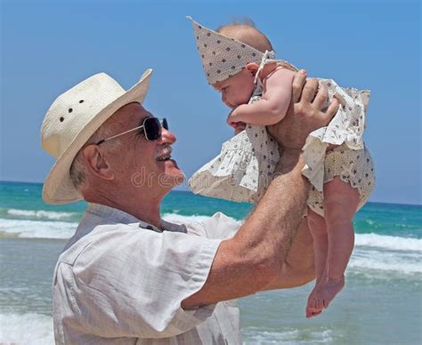 Grandpa Is Holding A Little Granddaughter Stock Image Image Of Active Girls 22865395