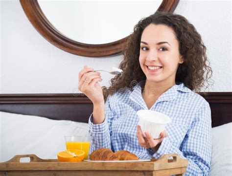 Brunette Girl Having Breakfast In Bed And Smiling Stock Photo Image