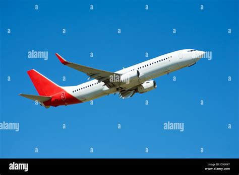 Large Passenger Plane Flying In The Blue Sky Stock Photo Alamy