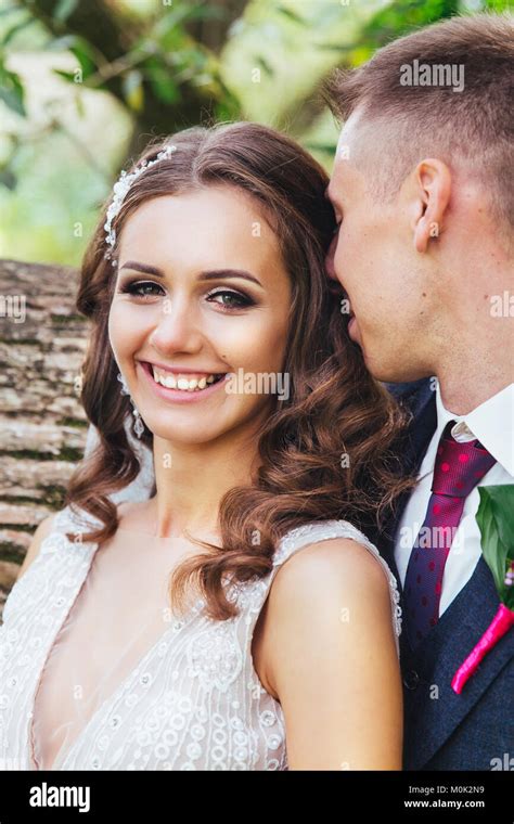 Beautiful Newlywed Bride And Groom Hugging In Park Face Close Up Stock
