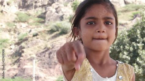 Stock Video Of Finger Pointing Straight Towards The Camera By A Lovely Little Indian Girl With
