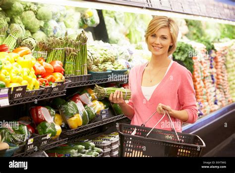 Woman Shopping In Supermarket Stock Photo Alamy