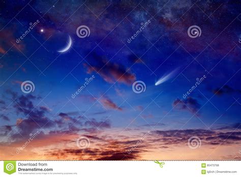 Bright Comet Falling Star And Crescent In Glowing Sunset Sky Stock