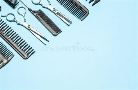 Black Combs And Combs With Scissors On Blue Background Copy Space For