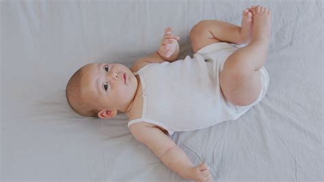 Cute Smiling Baby Lying On The Bed Stock Video Footage Storyblocks