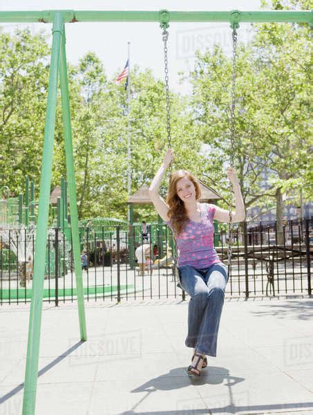 Woman Swinging In Park Stock Photo Dissolve