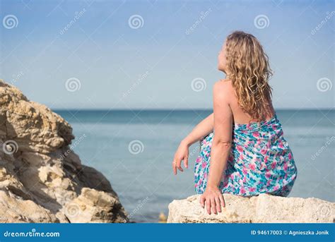 Woman Sitting On Rocks Stock Image Image Of Rocks Paradise 94617003