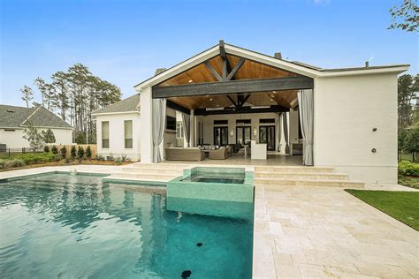 Outdoor Living Area Walkout To In Ground Pool With Hot Tub And Outdoor