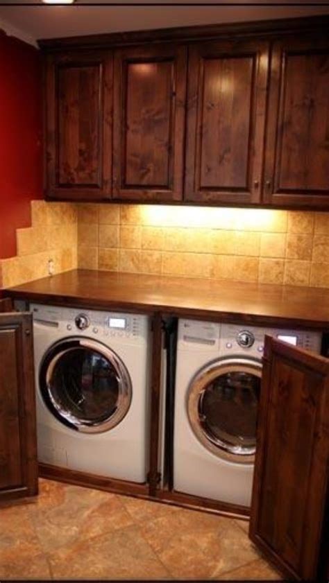 When it comes to laundry storage solutions for keeping laundry rooms tidy and organized, there are so many options ranging from rolling caddy in between the washer and dryer, adding a pull out ironing board in the laundry cabinet to repurposing a crib spring as a drying rack and mounting brackets on. Laundry room - doors to hide washer/dryer | Laundry Room ...