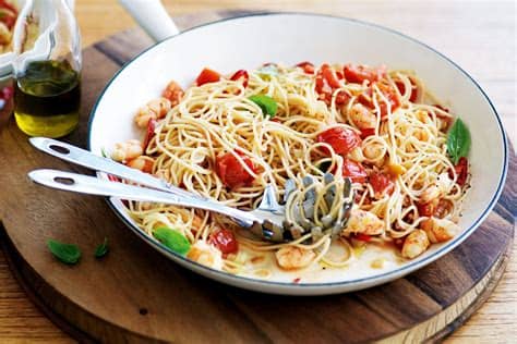 Pat the shrimp and scallops dry, then season with salt and drain the pasta and transfer to a large serving bowl. angel hair pasta with tomatoes