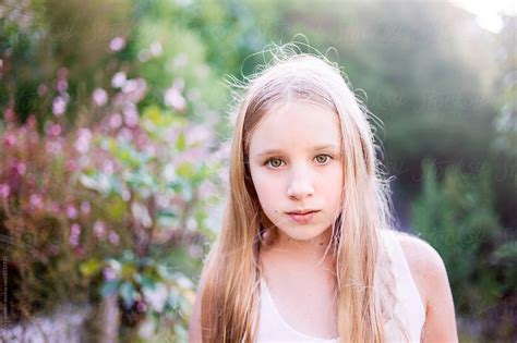 Young Girl Outdoors In Summer By Stocksy Contributor Angela Lumsden Stocksy