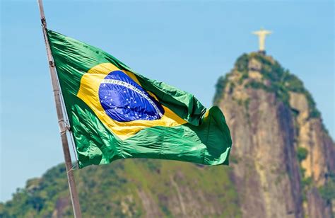 Brazilian Waving Flag On Rio De Janeiro Brazil Into The Blue