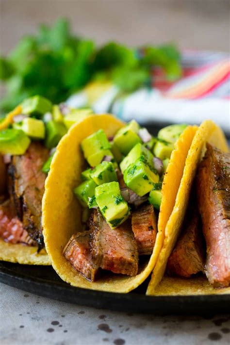 Steak Tacos Topped With Avocado Red Onion And Cilantro Easy Dinner
