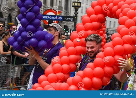lgbt people and supporters parading at the famous pride parade in london uk editorial stock